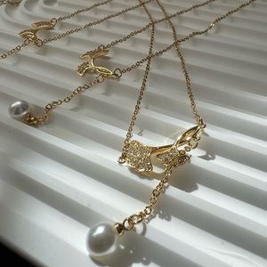 Faux gold and faux pearl necklace , mermaid tale pendant